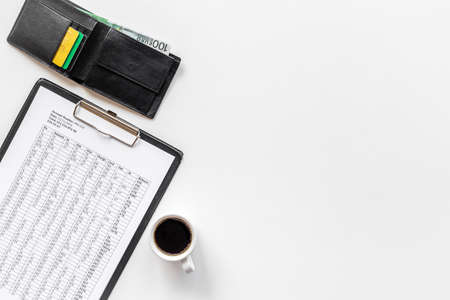 Calculating bills or taxes reports with with purse and bank cards, top viewの写真素材
