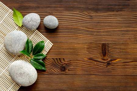 Relax and meditation with spa stones and green leavesの写真素材