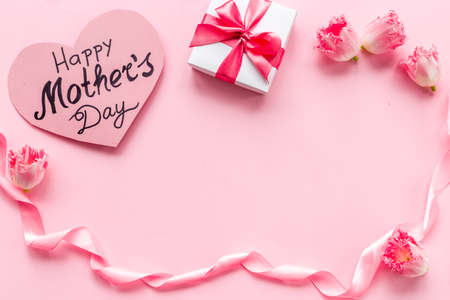 Happy Mothers day background with pink flowers, top viewの写真素材