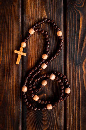 Wooden rosary beads with cross, top view. Christian conceptの写真素材