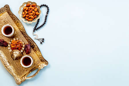 Ramadan Kareem greeting card. Table with dates fruits nuts and islamic rosaryの写真素材