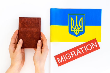 Ukrainian refugees migration concept. Ukraine flag and passport