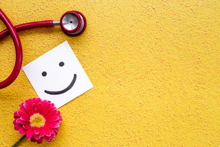 Breast cancer and women health background with red flowerの写真素材