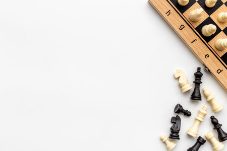 Top view of chess pieces battle on chessboard. Teamwork conceptの写真素材