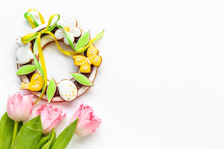 Easter bunny cookies with tulips flowers, top viewの写真素材