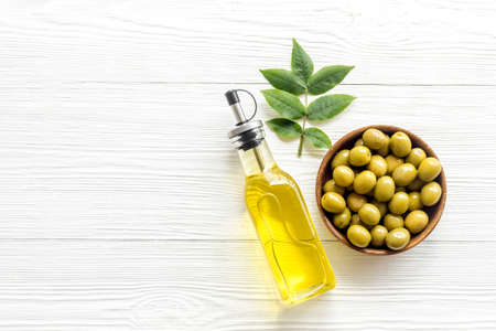 Olive oil in bottle with ingredient - green olivesの写真素材