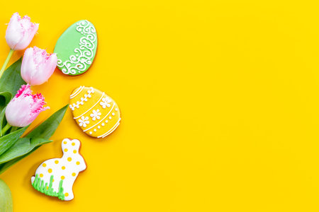 Happy Easter with pink tulips and cookies. Easter background