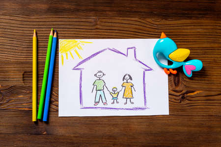 Childs drawing of happy family. Adoption conceptの写真素材