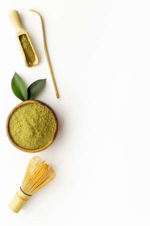 Green matcha with bamboo whisk. Powder in wooden bowlの写真素材
