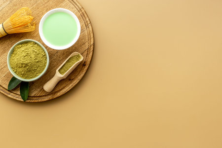 Green hot tea in bowls with matcha powder, top view