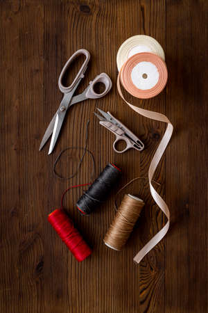 Tailoring scissors with bobbins of thread. Sewing backgroundの写真素材