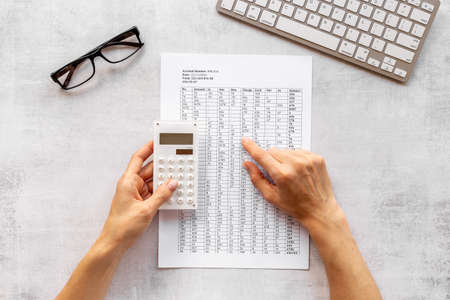 Taxes report or bills in businessman hands - financial accountingの写真素材