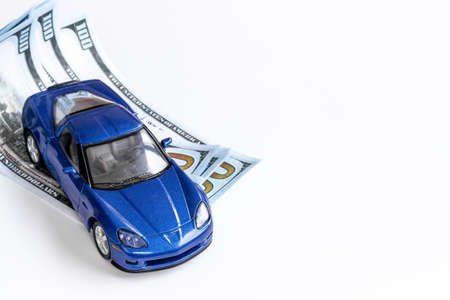Saving money to buy a car. Toy car with money cashの写真素材