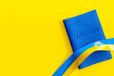 Yellow and blue ribbon with passport. Ukrainian immigration conceptの写真素材
