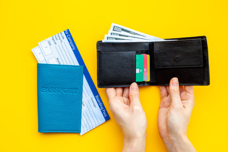 Hand holding passport with air tickets. Vacation tourism concept