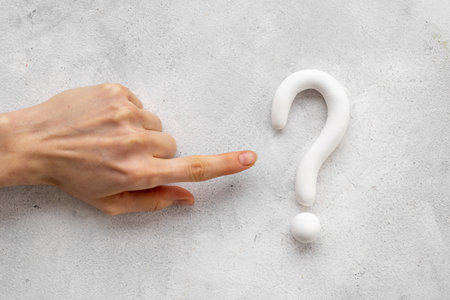 Hand with question mark symbol. FAQ and help conceptの写真素材