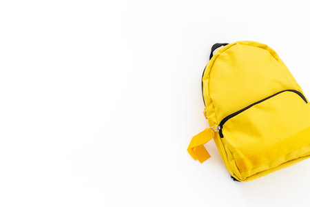Yellow classic school bag, top view. Back to school conceptの写真素材