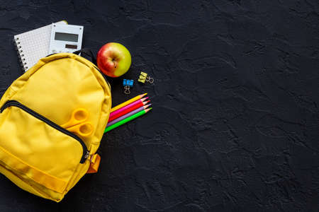 Yellow school backpack. Back to school concept. Top viewの写真素材