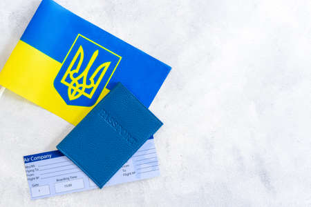 Passpot with tickets on Ukrainian flag. Ukrainian immigration conceptの写真素材