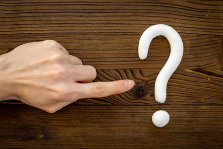 Hand with question mark symbol. FAQ and help concept