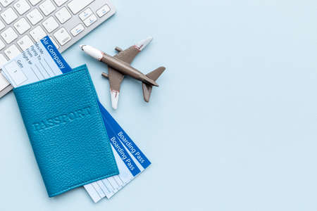 Immigration ot travel concept with tickets in passport and airplaneの写真素材