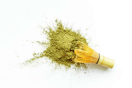 Isolated splash of matcha tea powder on white backgroundの写真素材