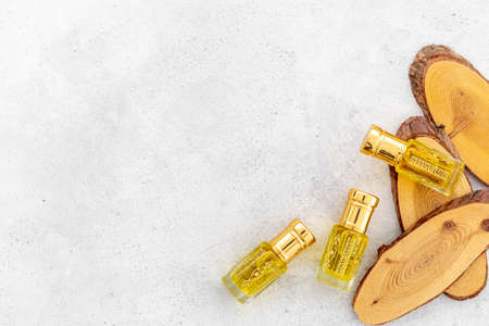 Arabian oud attar oil - perfume in glass bottles. Overhead view