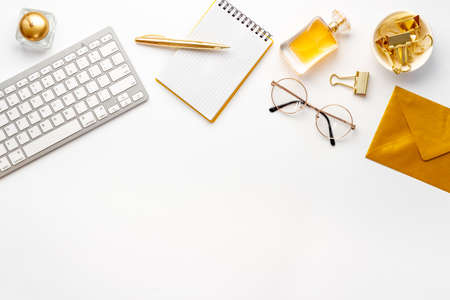 Work place office flatlay with golden colored office supplies, top viewの写真素材
