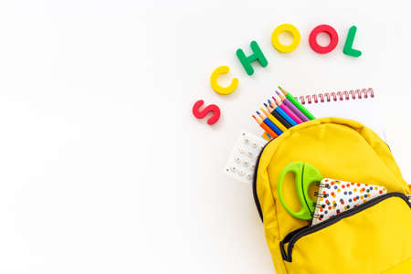 Yellow school backpack. Back to school concept. Top viewの写真素材