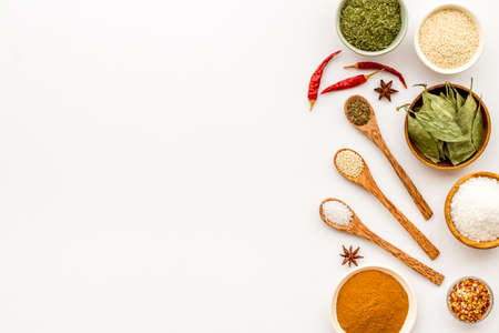 Set of colorful spices and herbs in bowls, top viewの写真素材