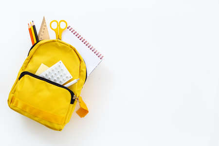 Yellow school backpack. Back to school concept. Top viewの写真素材