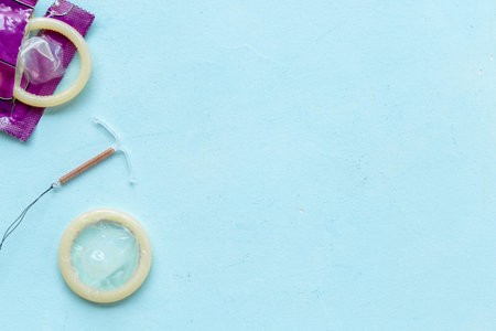 T-shaped intrauterine birth control device with condoms. Contraception conceptの写真素材