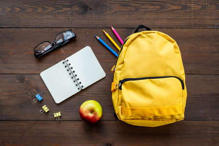 Yellow classic school bag, top view. Back to school conceptの写真素材