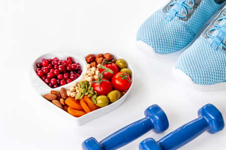 Sports nutrition diet. Healthy food with fitness equipmentの写真素材