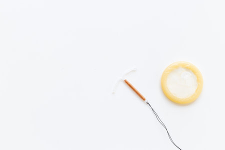 T-shaped intrauterine birth control device with condoms. Contraception conceptの写真素材
