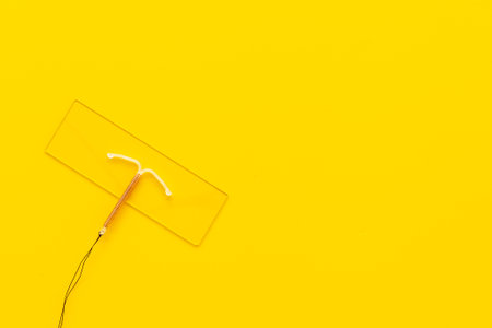 Intrauterine contraceptive device on medical glass. Gynecologist tableの写真素材