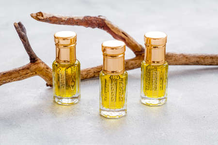 Bottles of agarwood tree oil perfume, close up. Traditional Arabian fragrance