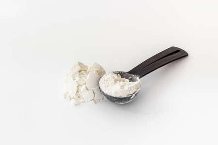 Whey protein powder on scoop. Fitness and gym diet nutritionの写真素材