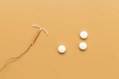 T-shaped intrauterine contraceptive device with medicine pills. Alternative methods of contraceptionの写真素材
