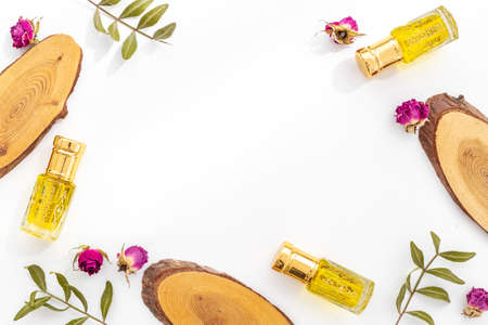 Perfume essential oil in glass bottles, top view. Traditional Arabian fragrance