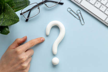 Question mark sign made of plasticine. FAQ and help conceptの写真素材