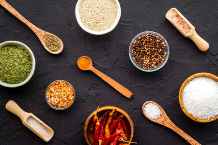 Powdered spices and herbs in bowls. Colorful cooking backgroundの写真素材