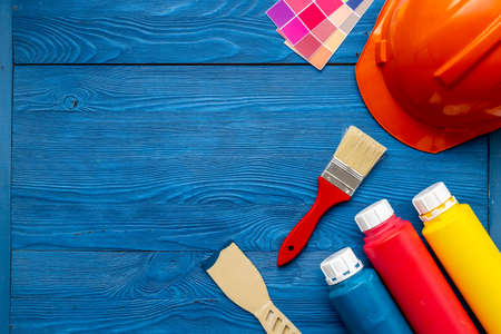House renovation and painting background with construction helmet and brushesの写真素材
