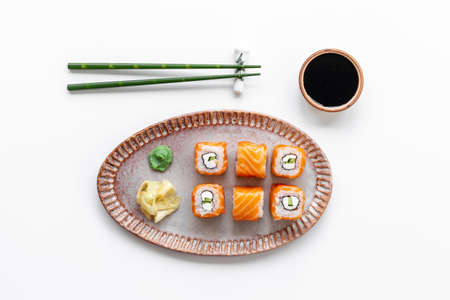 Sushi menu concept. Sushi roll set with salmon on dish