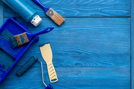 House renovation and painting tools with paintbrushes