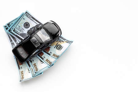 Saving money to buy a car. Toy car with money cashの写真素材