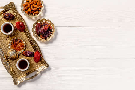 Ramadan Kareem greeting card. Table with dates fruits nuts and islamic rosaryの写真素材
