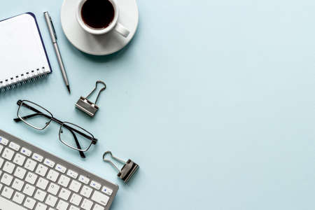 Silver colored office supplies on office desk, top viewの写真素材