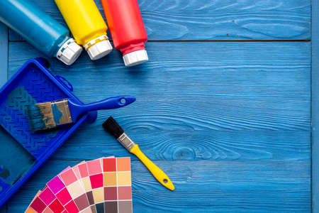 Paintbrush and color palette guide, top view. House renovation toolsの写真素材