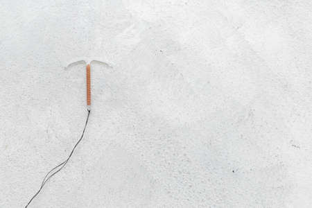 T-shaped intrauterine contraceptive device. Hormone free contraception conceptの写真素材